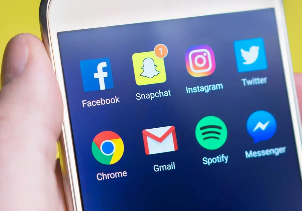 Smartphone displaying popular social media app icons, symbolizing social media marketing.